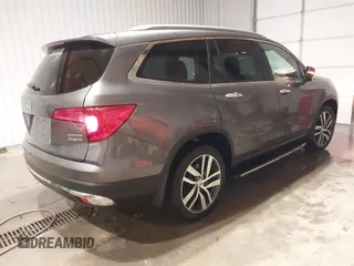 2017 Honda Pilot Touring with VIN 5FNYF6H91HB084737, listed as a IAAI auction lot 41608145 with 86,696 mi miles. Bid and sale history available at carsss.com. Image 4.