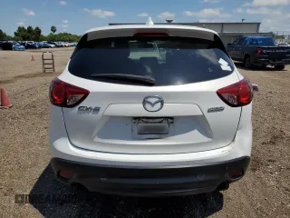 2014 Mazda CX-5 Touring with VIN JM3KE2CY9E0305244, listed as a Copart auction lot 56205605 with 164,516 mi miles and Salvage Title. Bid and sale history available at DreamBid. Image 6.