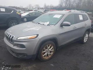 2014 Jeep Cherokee Latitude with VIN 1C4PJLCBXEW299124, listed as a IAAI auction lot 41553472 with 151,893 mi miles. Bid and sale history available at carsss.com. Image 17.