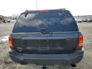 2004 Jeep Grand Cherokee Laredo with VIN 1J4GW48S84C184757, listed as a Copart auction lot 52895745 with 242,307 mi miles and Salvage Title. Bid and sale history available at carsss.com. Image 6.