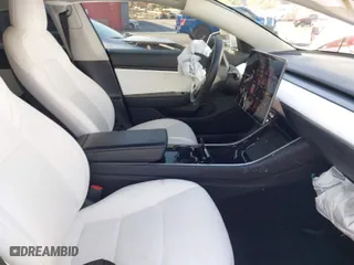 2020 Tesla Model 3 Standard Range Plus with VIN 5YJ3E1EA1LF615250, listed as a IAAI auction lot 41444030 with 76,810 mi miles. Bid and sale history available at carsss.com. Image 5.