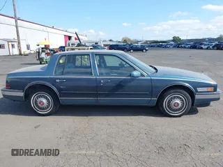 1986 Cadillac Seville z VIN 1G6KS6989GU813079, wystawiony jako IAAI lot #41732353 z przebiegiem Nie podano mil oraz . Historia ofert i sprzedaży dostępna na DreamBid. Obrazek 13.