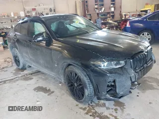 2023 BMW X4 M with VIN 5YM23EC05P9R57259, listed as a IAAI auction lot 41003784 with 33,928 mi miles. Bid and sale history available at carsss.com. Image 1.