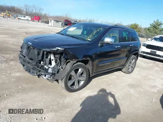 2014 Jeep Grand Cherokee Overland with VIN 1C4RJECG4EC523747, listed as a IAAI auction lot 40802143 with 124,079 mi miles. Bid and sale history available at carsss.com. Image 2.