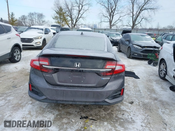 2018 Honda Clarity z VIN JHMZC5F13JC006627, wystawiony jako IAAI lot #41335364 z przebiegiem 58 662 mil mil oraz . Historia ofert i sprzedaży dostępna na DreamBid. Obrazek 16.
