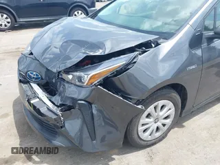 2021 Toyota Prius L Eco z VIN JTDKAMFU3M3152785, wystawiony jako IAAI lot #42501351 z przebiegiem 60 489 mil mil oraz . Historia ofert i sprzedaży dostępna na DreamBid. Obrazek 17.