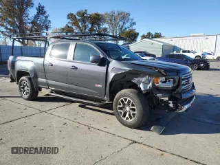 2015 GMC Canyon 2WD SLE with VIN 1GTG5BE38F1240947, listed as a Copart auction lot 82707204 with 63,049 mi miles and Salvage Title. Bid and sale history available at carsss.com. Image 4.
