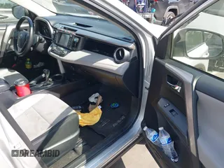 2016 Toyota RAV4 Hybrid XLE with VIN JTMRJREVXGD029019, listed as a IAAI auction lot 42021530 with 74,400 mi miles. Bid and sale history available at carsss.com. Image 5.