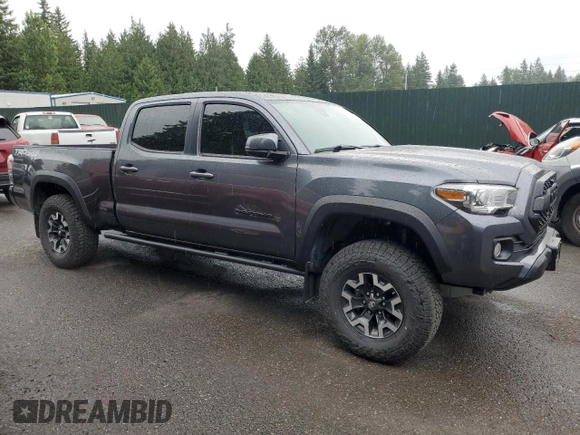 2020 Toyota Tacoma SR5 with VIN 3TMDZ5BN2LM097782, listed as a Copart auction lot 61573465 with 57,321 mi miles and Salvage title. Bid and sale history available at DreamBid. Image 4.