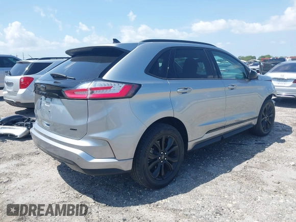 2024 Ford Edge SE with VIN 2FMPK4G91RBA63054, listed as a IAAI auction lot 41973609 with 14,707 mi miles and . Bid and sale history available at DreamBid. Image 4.