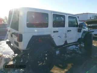 2014 Jeep Wrangler Unlimited Sahara with VIN 1C4HJWEG2EL273813, listed as a IAAI auction lot 41311011 with 96,104 mi miles. Bid and sale history available at carsss.com. Image 4.