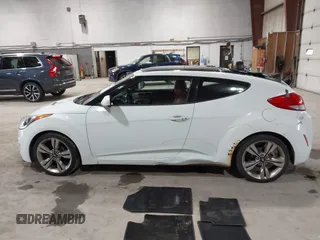 2012 Hyundai Veloster w/Black Int with VIN KMHTC6AD3CU080878, listed as a IAAI auction lot 42377636 with 152,430 mi miles and . Bid and sale history available at DreamBid. Image 14.