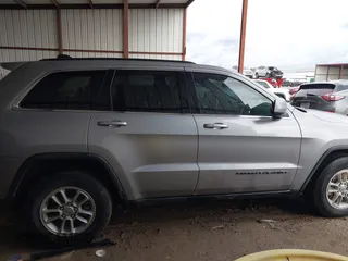 2018 Jeep Grand Cherokee Laredo E with VIN 1C4RJEAG1JC275356, listed as a IAAI auction lot 42150422 with 69,720 mi miles and . Bid and sale history available at DreamBid. Image 13.