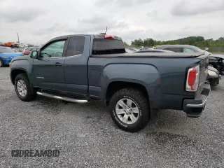 2015 GMC Canyon 2WD SLE with VIN 1GTH5BEA7F1158758, listed as a Copart auction lot 63617524 with 102,744 mi miles and Salvage Title. Bid and sale history available at carsss.com. Image 2.