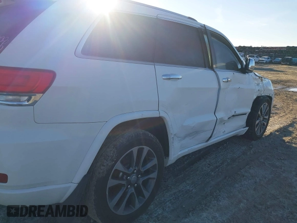 2017 Jeep Grand Cherokee Overland with VIN 1C4RJFCG8HC641729, listed as a IAAI auction lot 41233125 with 116,874 mi miles. Bid and sale history available at carsss.com. Image 19.