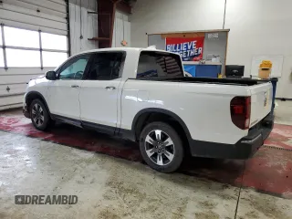 2017 Honda Ridgeline RTL-E with VIN 5FPYK3F72HB002890, listed as a Copart auction lot 57699735 with 128,813 mi miles and Salvage title. Bid and sale history available at DreamBid. Image 2.
