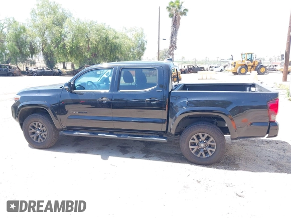 2023 Toyota Tacoma SR with VIN 3TMCZ5AN1PM654572, listed as a IAAI auction lot 42312575 with 14,111 mi miles and . Bid and sale history available at DreamBid. Image 14.