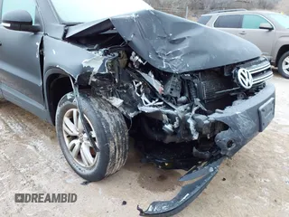 2017 Volkswagen Tiguan S with VIN WVGBV7AX8HK027148, listed as a IAAI auction lot 41215649 with 132,690 mi miles and . Bid and sale history available at DreamBid. Image 6.
