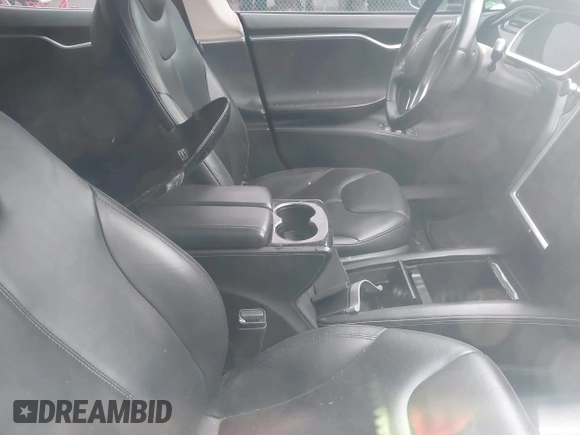 2014 Tesla Model S 60 with VIN 5YJSA1H13EFP33693, listed as a IAAI auction lot 42132094 with Not Provided miles and . Bid and sale history available at DreamBid. Image 5.