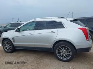 2015 Cadillac SRX Performance Collection z VIN 3GYFNCE36FS633386, wystawiony jako IAAI lot #41851338 z przebiegiem 102 586 mil mil oraz . Historia ofert i sprzedaży dostępna na DreamBid. Obrazek 14.
