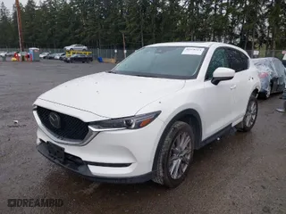 2021 Mazda CX-5 Grand Touring with VIN JM3KFBDM2M0357788, listed as a IAAI auction lot 41970254 with 56,153 mi miles. Bid and sale history available at carsss.com. Image 2.