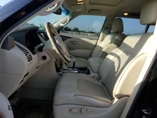2015 Infiniti QX80 with VIN JN8AZ2NF5F9573374, listed as a Copart auction lot 57489775 with 128,848 mi miles and Salvage title. Bid and sale history available at DreamBid. Image 7.