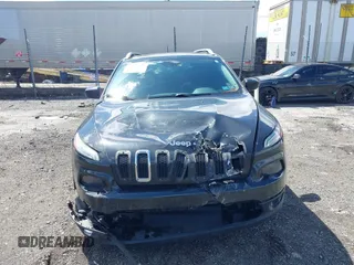 2014 Jeep Cherokee Latitude with VIN 1C4PJMCS8EW257959, listed as a IAAI auction lot 41987529 with 124,749 mi miles. Bid and sale history available at carsss.com. Image 13.