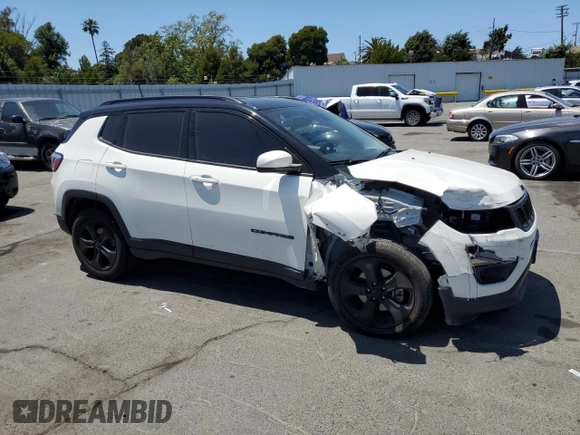 2020 Jeep Compass Latitude with VIN 3C4NJCBB8LT257630, listed as a Copart auction lot 58979745 with 128,196 mi miles and Salvage title. Bid and sale history available at DreamBid. Image 4.