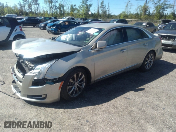 2014 Cadillac XTS z VIN 2G61L5S39E9159583, wystawiony jako IAAI lot #36024597 z przebiegiem 118 461 mil mil oraz . Historia ofert i sprzedaży dostępna na DreamBid. Obrazek 2.