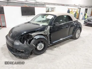 2014 Volkswagen Beetle 1.8T с VIN 3VW517AT5EM818796, выставлен на аукционе IAAI как лот 42318653 с пробегом 150 443 миль миль и . История ставок и продаж доступна на DreamBid. Изображение 2.