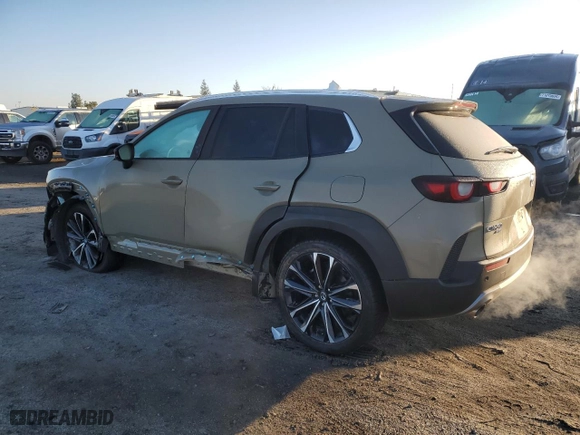 2023 Mazda CX-50 2.5 Turbo Premium Plus Package with VIN 7MMVABEY3PN101558, listed as a Copart auction lot 42877635 with 52,778 mi miles and Salvage Title. Bid and sale history available at carsss.com. Image 2.
