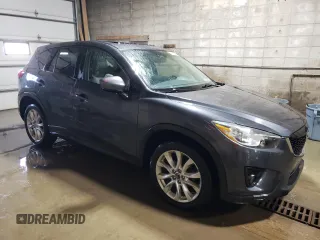2015 Mazda CX-5 Grand Touring with VIN JM3KE4DY1F0454713, listed as a Copart auction lot 48548285 with 132,454 mi miles and Salvage Title. Bid and sale history available at DreamBid. Image 4.
