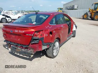 2018 Ford Focus Titanium with VIN 1FADP3J20JL281141, listed as a IAAI auction lot 42437424 with 113,499 mi miles and . Bid and sale history available at DreamBid. Image 4.