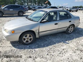 2000 Toyota Corolla VE with VIN 2T1BR12E1YC269820, listed as a Copart auction lot 62935185 with 305,906 mi miles and Salvage title. Bid and sale history available at DreamBid. Image 1.