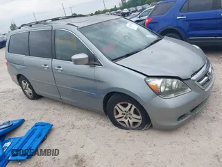 2005 Honda Odyssey EX-L z VIN 5FNRL38775B117598, wystawiony jako IAAI lot #42276239 z przebiegiem 184 134 mil mil oraz . Historia ofert i sprzedaży dostępna na DreamBid. Obrazek 1.