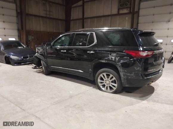 2021 Chevrolet Traverse High Country with VIN 1GNEVNKW9MJ150993, listed as a IAAI auction lot 41224329 with 100,425 mi miles. Bid and sale history available at carsss.com. Image 3.