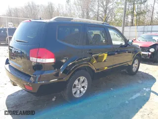 2009 Kia Borrego LX with VIN KNDJJ741995037531, listed as a IAAI auction lot 41738591 with 210,029 mi miles. Bid and sale history available at carsss.com. Image 4.