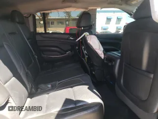 2015 Chevrolet Suburban LT z VIN 1GNSCJKC4FR549967, wystawiony jako Copart lot #57952955 z przebiegiem 311 163 mil mil oraz Szkoda całkowita • Salvage title. Historia ofert i sprzedaży dostępna na DreamBid. Obrazek 11.
