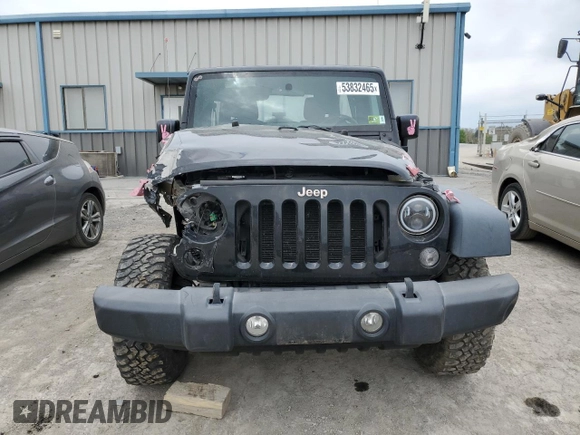 2015 Jeep Wrangler Unlimited Willys Wheeler with VIN 1C4BJWDG3FL601197, listed as a Copart auction lot 53832465 with 216,141 mi miles and Salvage Title. Bid and sale history available at DreamBid. Image 5.
