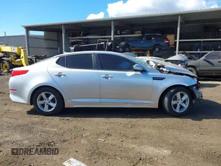 2015 Kia Optima LX z VIN 5XXGM4A74FG476636, wystawiony jako IAAI lot #41242478 z przebiegiem Nie podano mil oraz . Historia ofert i sprzedaży dostępna na DreamBid. Obrazek 13.