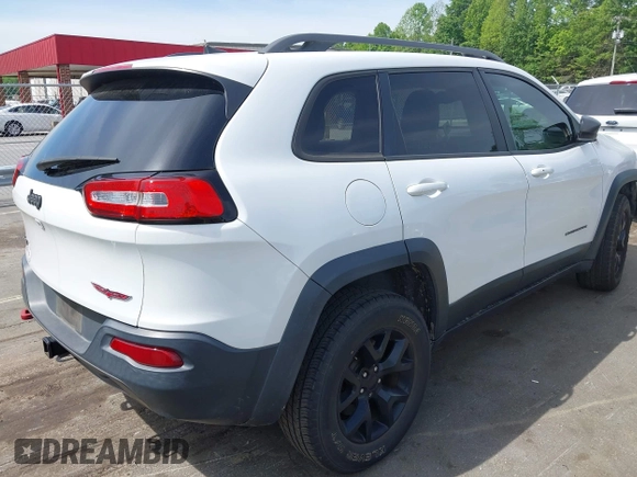 2016 Jeep Cherokee Trailhawk z VIN 1C4PJMBS7GW109189, wystawiony jako IAAI lot #42219470 z przebiegiem 115 197 mil mil oraz . Historia ofert i sprzedaży dostępna na DreamBid. Obrazek 4.
