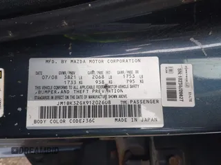 2009 Mazda Mazda3 i Touring Value with VIN JM1BK32GX91202608, listed as a IAAI auction lot 41867058 with 204,978 mi miles. Bid and sale history available at carsss.com. Image 9.