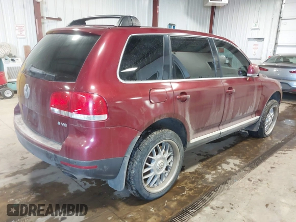 2004 Volkswagen Touareg z VIN WVGCM67LX4D038012, wystawiony jako IAAI lot #41285460 z przebiegiem Nie podano mil oraz . Historia ofert i sprzedaży dostępna na DreamBid. Obrazek 4.
