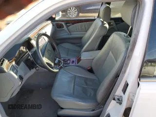 1999 Mercedes-Benz E-Class with VIN WDBJF82H1XX024280, listed as a Copart auction lot 83213204 with 212,712 mi miles and Salvage Title. Bid and sale history available at carsss.com. Image 7.