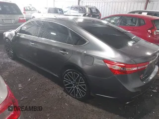 2015 Toyota Avalon Limited with VIN 4T1BK1EB6FU164773, listed as a IAAI auction lot 41877742 with 128,858 mi miles and . Bid and sale history available at DreamBid. Image 3.