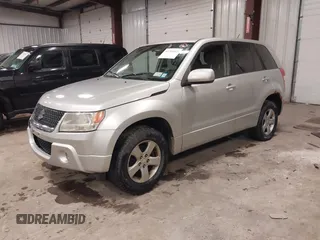 2012 Suzuki Grand Vitara Premium z VIN JS3TD0D62C4100440, wystawiony jako IAAI lot #41711815 z przebiegiem 171 527 mil mil oraz . Historia ofert i sprzedaży dostępna na DreamBid. Obrazek 17.