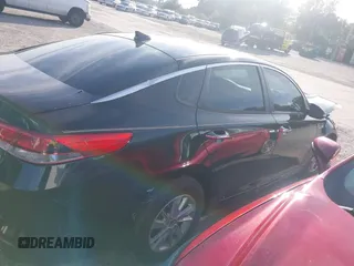 2016 Kia Optima LX with VIN 5XXGT4L31GG022844, listed as a IAAI auction lot 41240100 with 121,586 mi miles and . Bid and sale history available at DreamBid. Image 13.