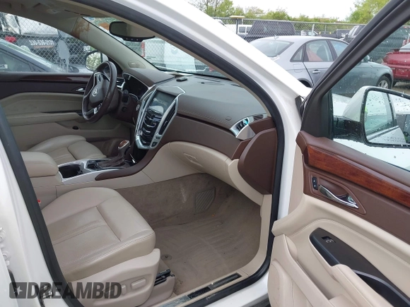 2014 Cadillac SRX Performance Collection with VIN 3GYFNCE34ES519059, listed as a IAAI auction lot 42237351 with 80,578 mi miles and . Bid and sale history available at DreamBid. Image 5.