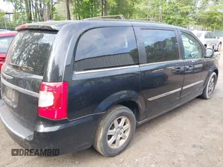 2012 Chrysler Town & Country Touring with VIN 2C4RC1BG7CR301101, listed as a IAAI auction lot 42173814 with 141,128 mi miles. Bid and sale history available at carsss.com. Image 4.