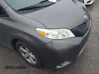 2015 Toyota Sienna L with VIN 5TDZK3DC9FS563593, listed as a IAAI auction lot 41466419 with 136,394 mi miles and . Bid and sale history available at DreamBid. Image 6.